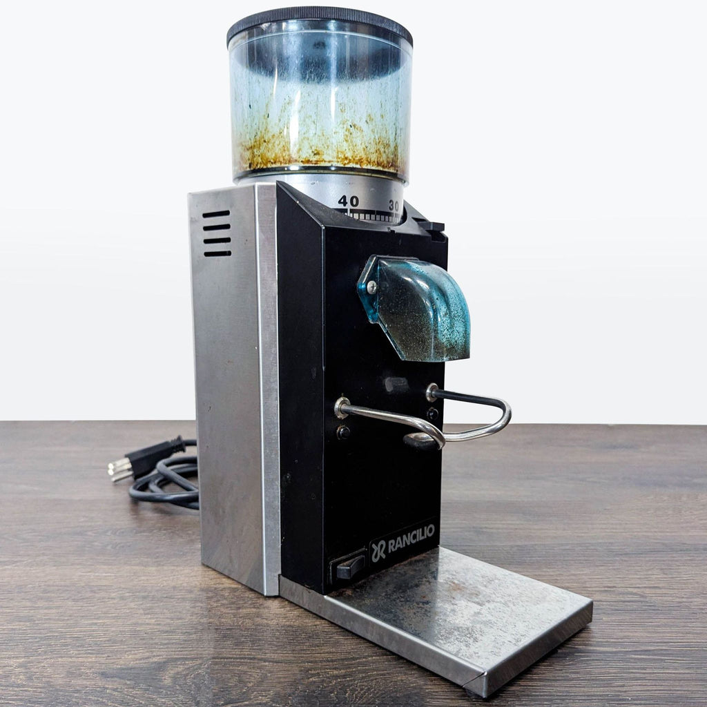 Used Rancilio coffee grinder, sturdy build, suitable for home or small café, features precise grind control.