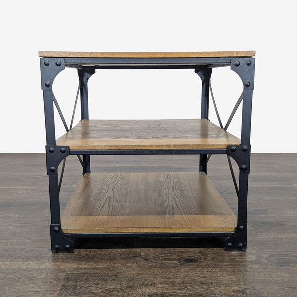 Industrial-style end table with three-tier rustic wood shelves and a black metal frame.  