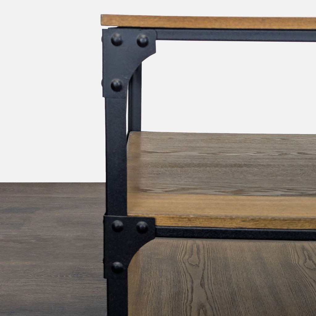 Three-tier end table featuring a black metal frame and rustic wood shelves for an industrial touch.