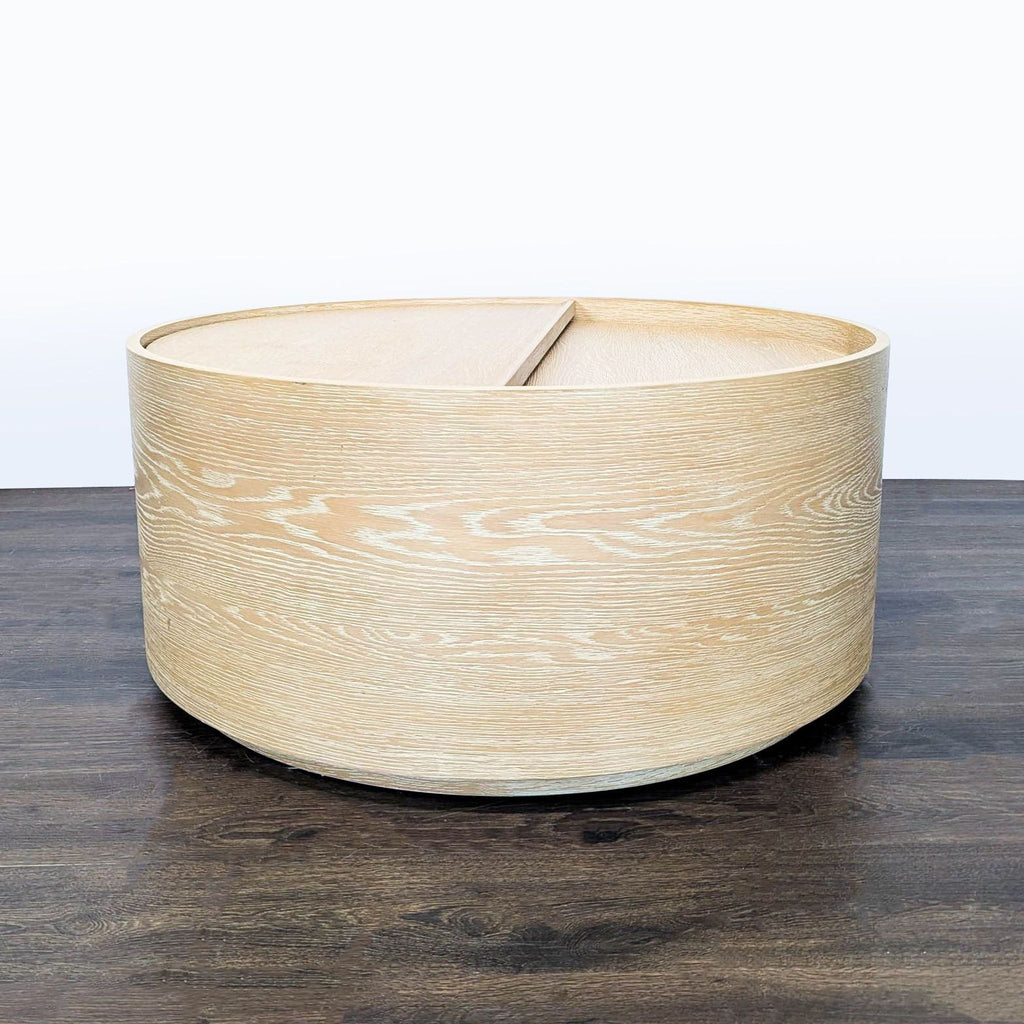 West Elm coffee table crafted from kiln-dried wood with a washed oak finish, viewed from above.