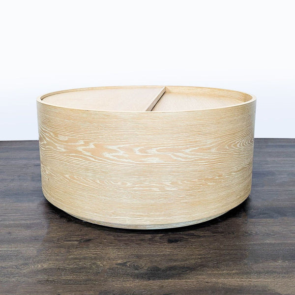 West Elm coffee table crafted from kiln-dried wood with a washed oak finish, viewed from above.