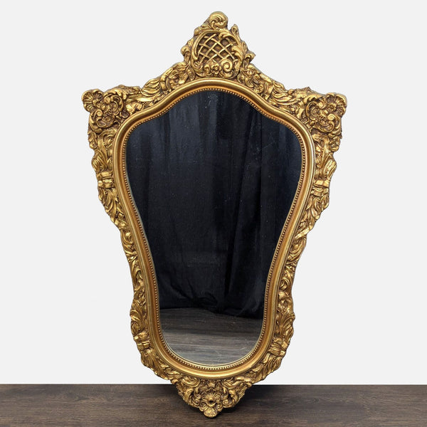 Ornate mirror featuring delicate floral carvings and decorative beaded border.
