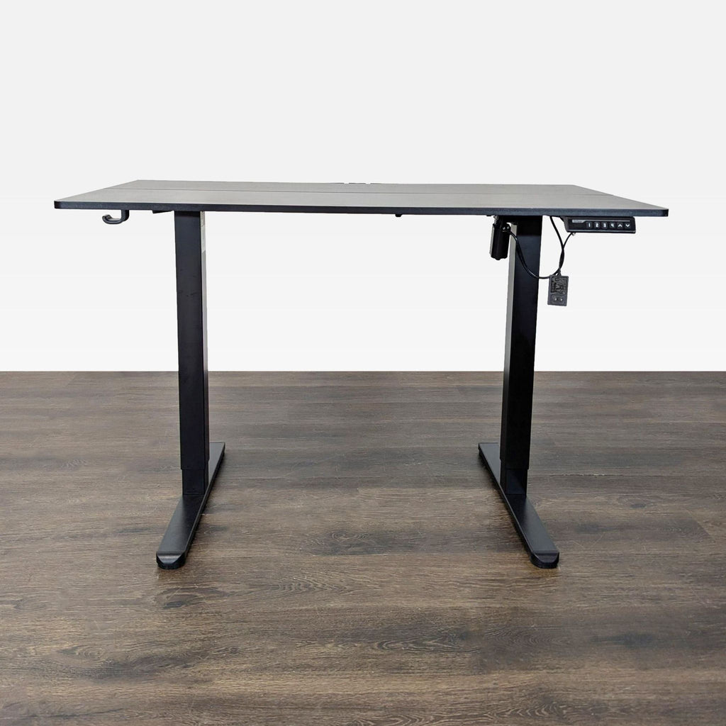 ErGear electric standing desk with memory presets, black frame, spacious tabletop, and side hook for accessories.