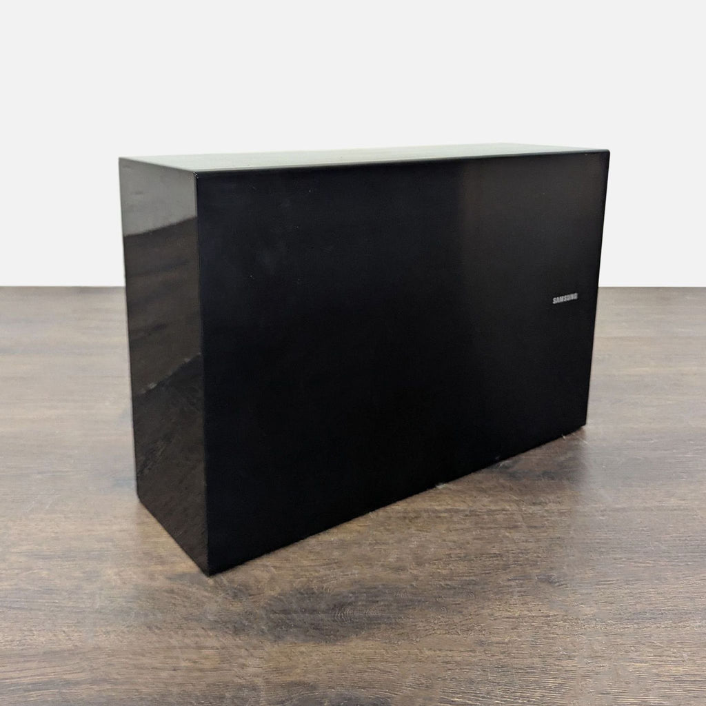 Side view of a Samsung curved LED TV highlighting its curved screen and sleek, minimalist design.