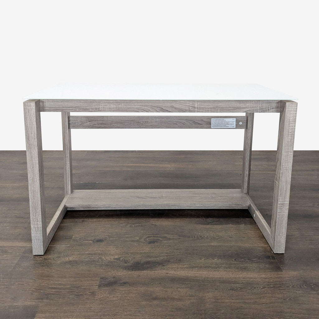 Modern Whalen Furniture desk with glass top, gray wood frame, and open lower shelf for storage.  