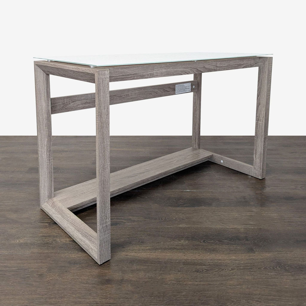 Sleek gray desk by Whalen Furniture featuring a glass top, spacious work area, and minimalist design.  