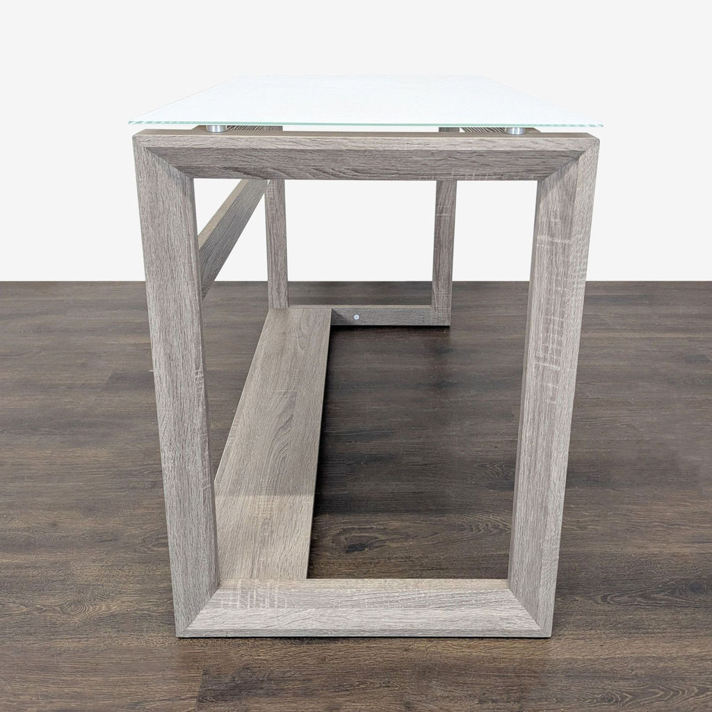 Contemporary Whalen desk with sturdy wood frame, clear glass surface, and extra legroom with storage shelf.