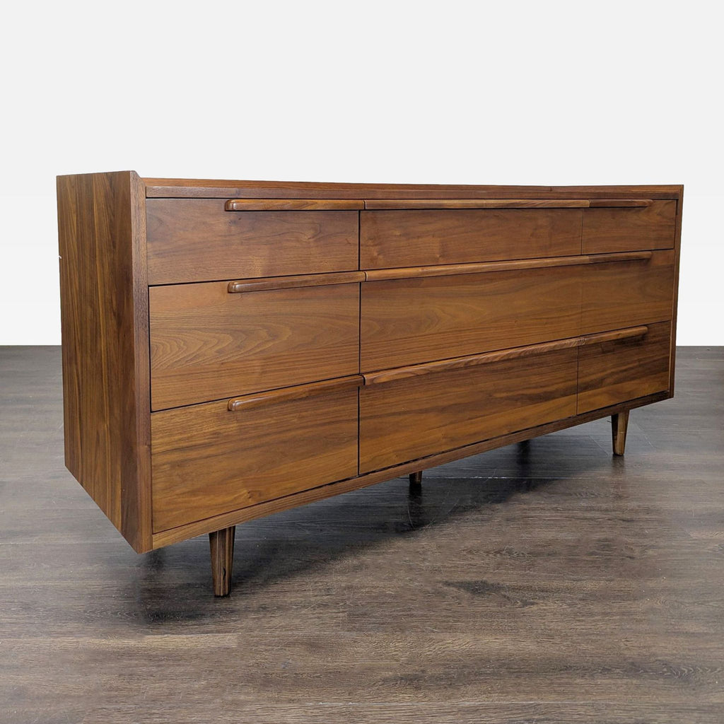 Crate & Barrel dresser with clean lines, sturdy legs, and a classic walnut look, offering ample storage.