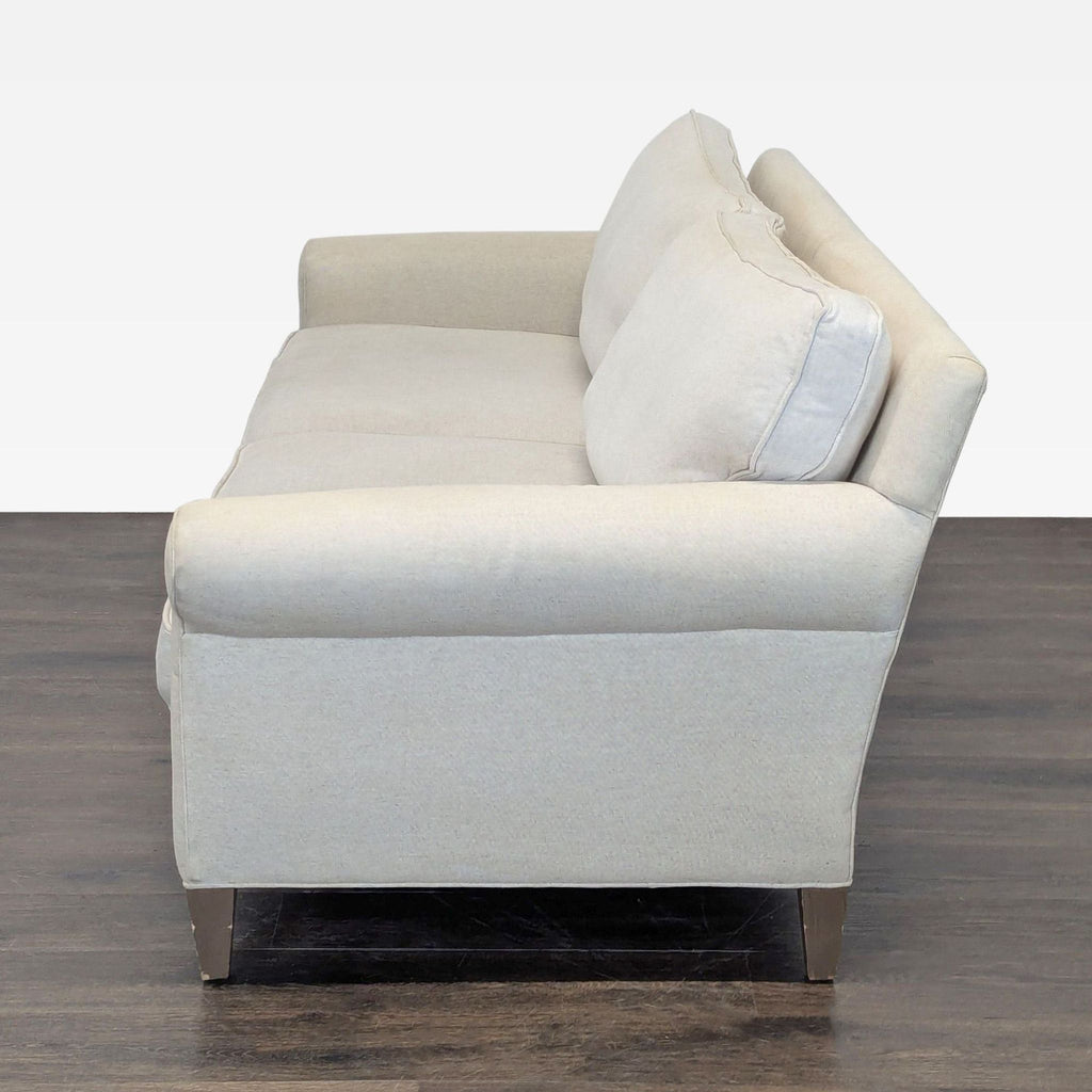 Neutral Crate & Barrel 3-seat sofa with simple style, soft upholstery, and supportive legs for living rooms.