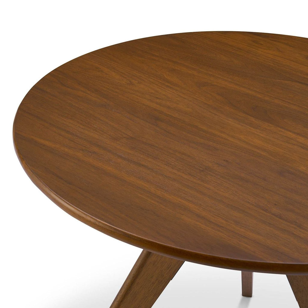 Castlery Tribeca table features a cane-accented top, walnut veneer surface, and sleek, angled solid rubberwood legs.