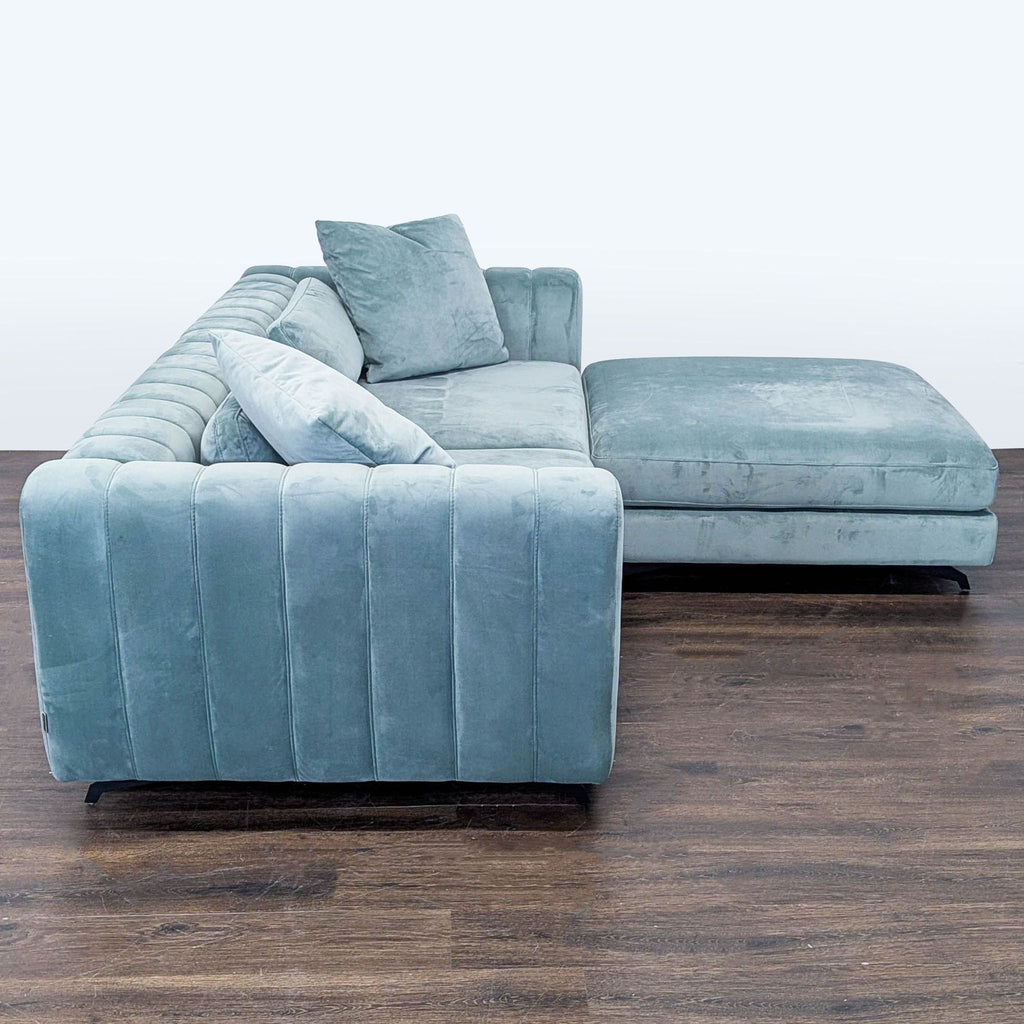 Spacious light blue Rove Concepts sofa set with ottoman and cushions, perfect for stylish, comfortable living rooms.
