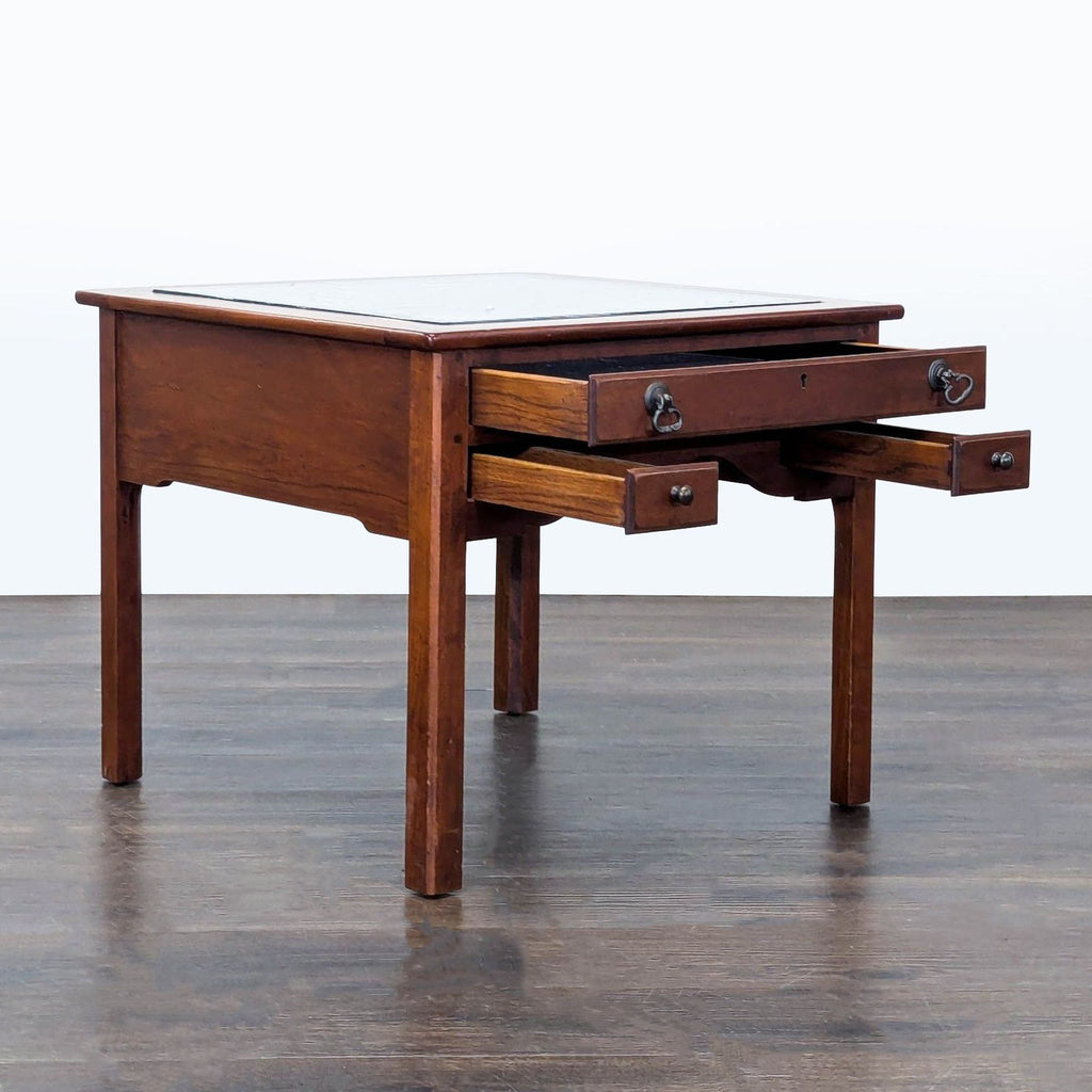 Three-drawer display coffee table by Ethan Allen, featuring glass top and felt-lined compartments.