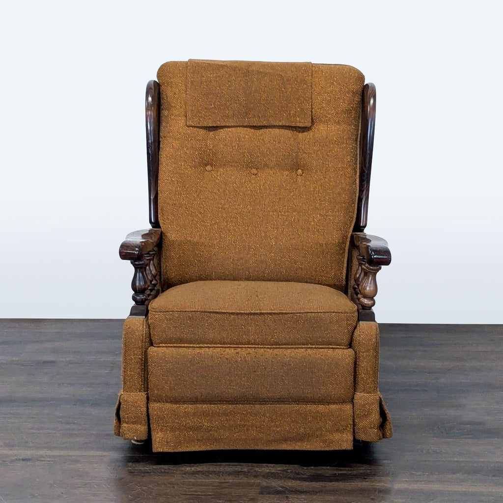 Vintage brown lounge chair with button-tufted back, carved wood armrests, and fold-out footrest.  