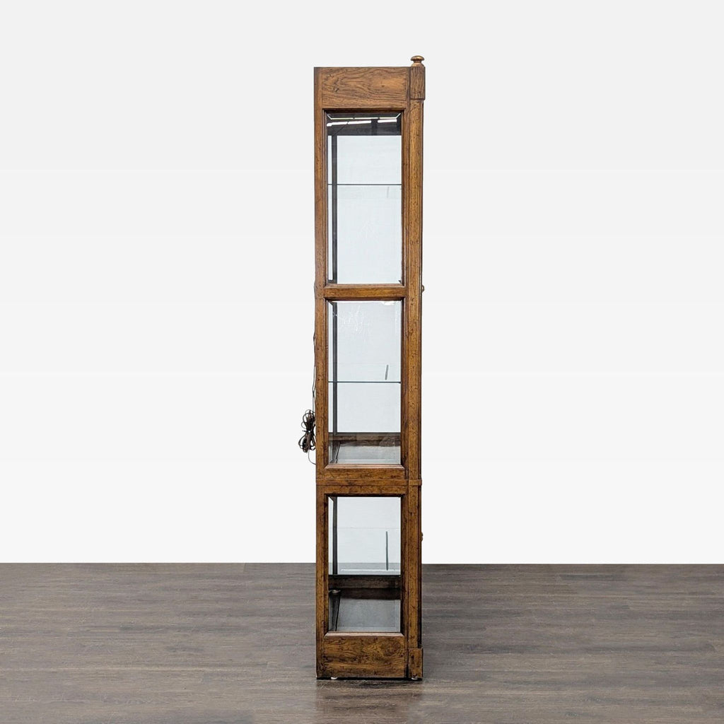 Cabinet by Drexel Heritage; wood construction, four cabinet doors, glass shelves, front, and side glass panels.