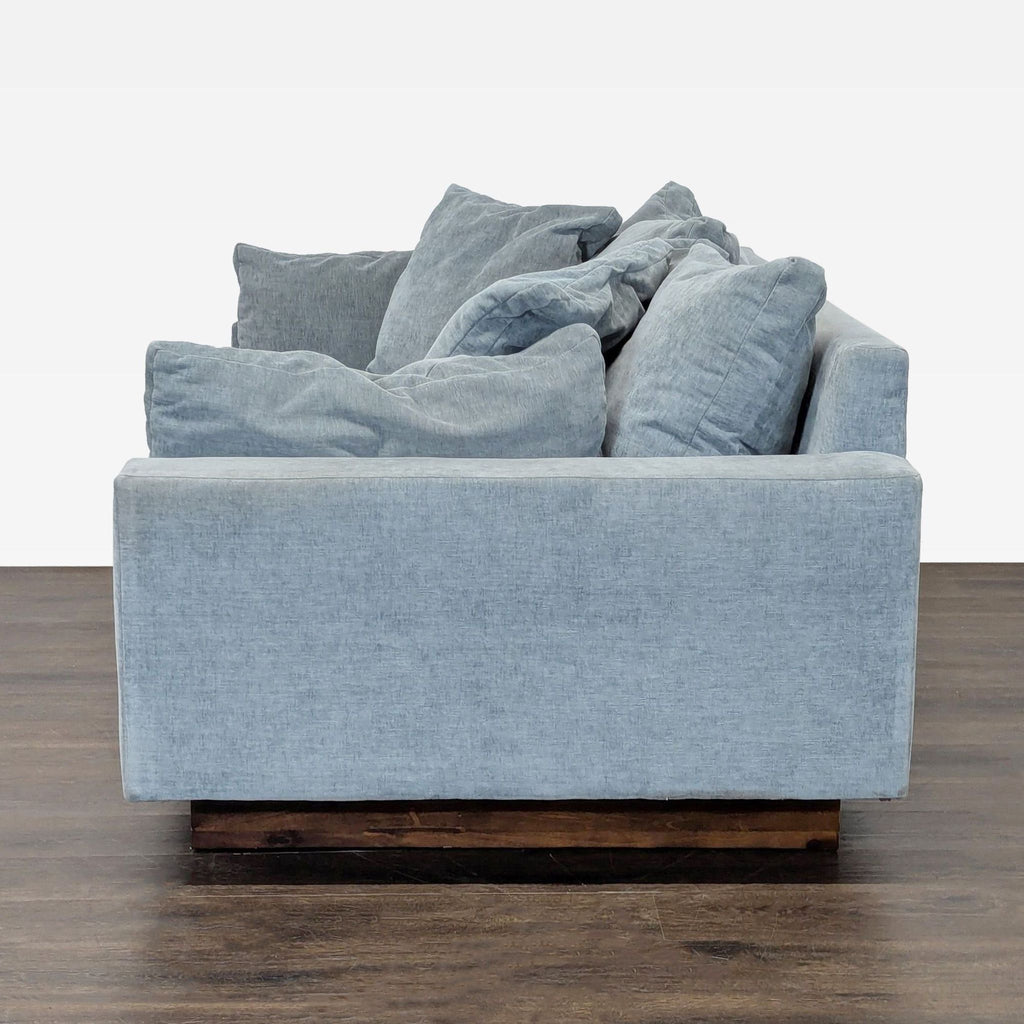 Modern West Elm velvet sofa, 76-inch, blue with a plush seat, dark walnut legs, and a 3-seat design.