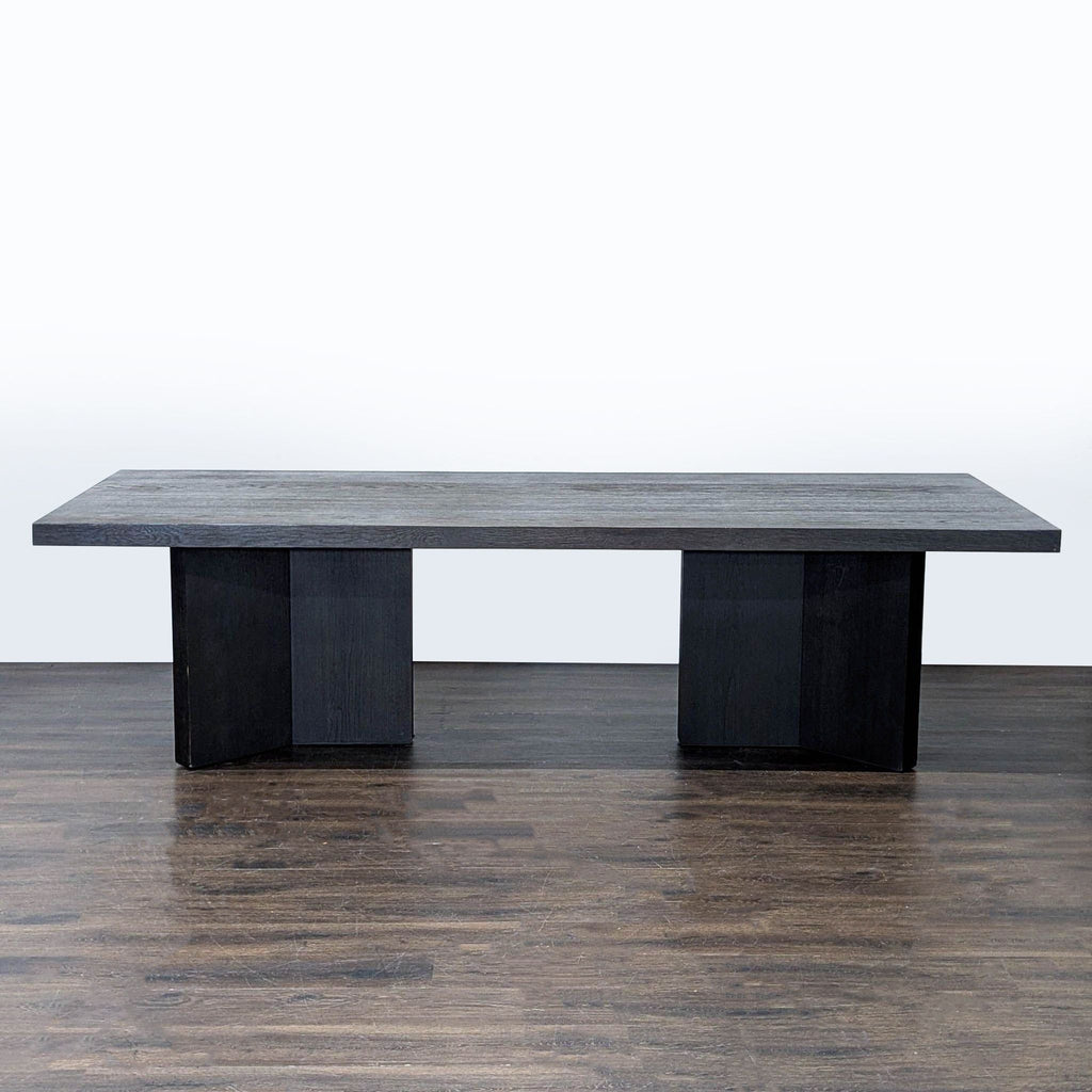 Elegant dining set by Restoration Hardware featuring a large rectangular table and ten comfortable, neutral chairs.  