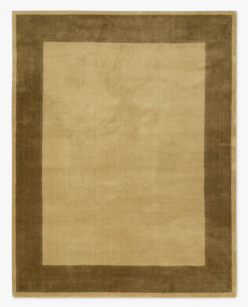 Rectangular Lulu and Georgia rug with beige center and wide brown border, modern and minimalist design.  