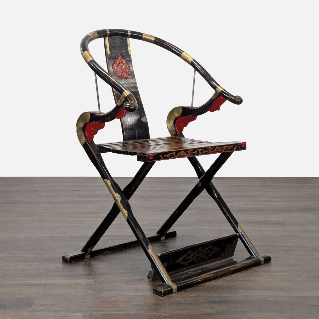 Traditional wooden lounge chair featuring a curved back, decorative red and gold details, and a foldable frame.