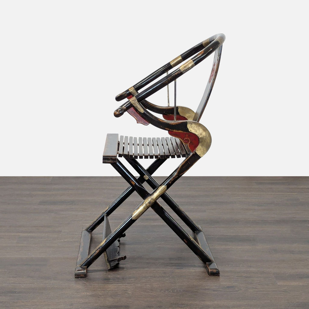 Elegant, worn-look lounge chair with Chinese design elements, folding structure, and intricate gold-red touches.