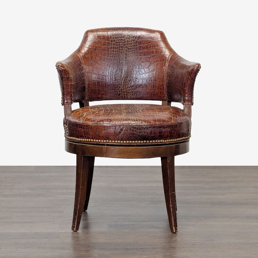 Brown alligator-patterned leather lounge chair with brass nailhead trim and sturdy wooden legs.  