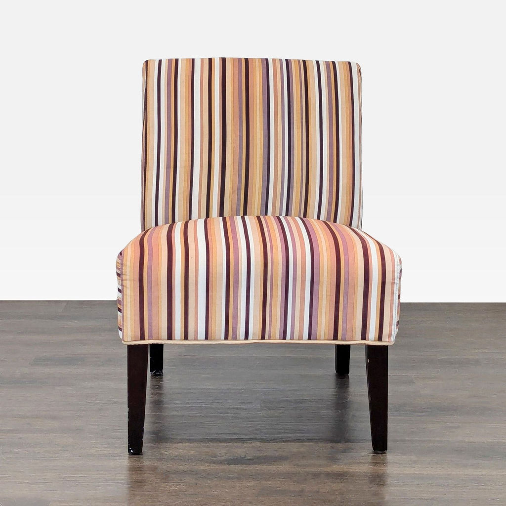 Armless lounge chair with multicolored striped fabric and solid wood legs, perfect for a modern accent.  