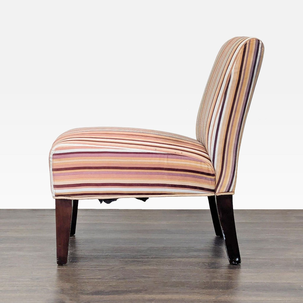 Colorful striped lounge chair without arms, offering comfort and style with its cushioned seat and back.