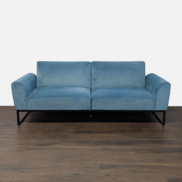 Dorel Home Furnishings 3-seat sofa in soft blue upholstery with a black metal frame, convertible to a bed.
