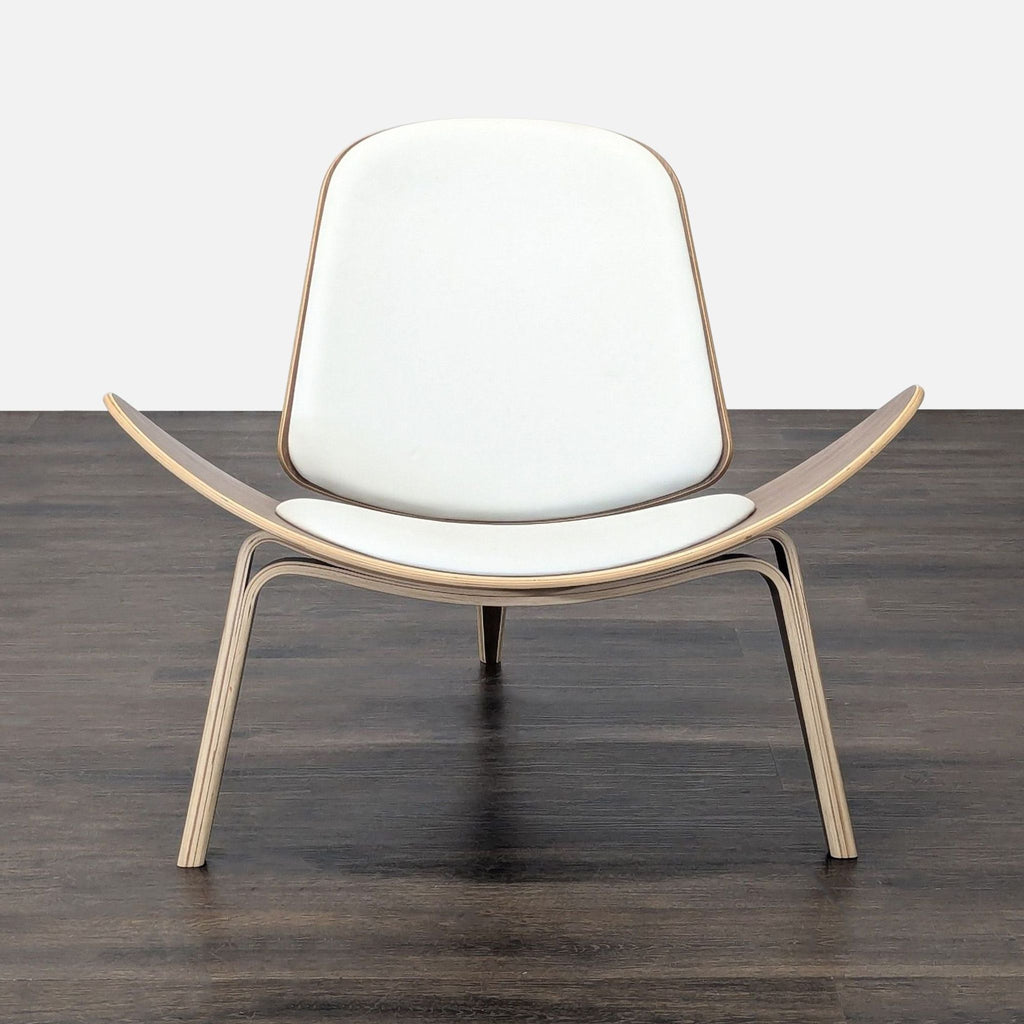 1. Modern lounge chair with a curved wooden frame, white cushioned seat, and three-legged design for stability.