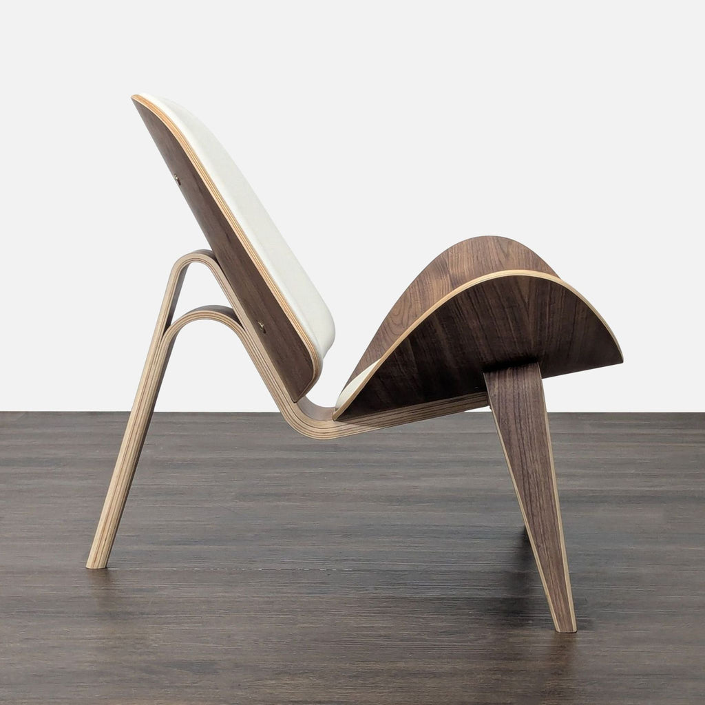 3. Profile of a contemporary lounge chair with a bent wooden frame, white upholstered seat, and stable three-legged base.