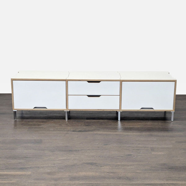 Modern white Scandinavian Designs cabinet with light wood accents, metal legs, and spacious storage areas.