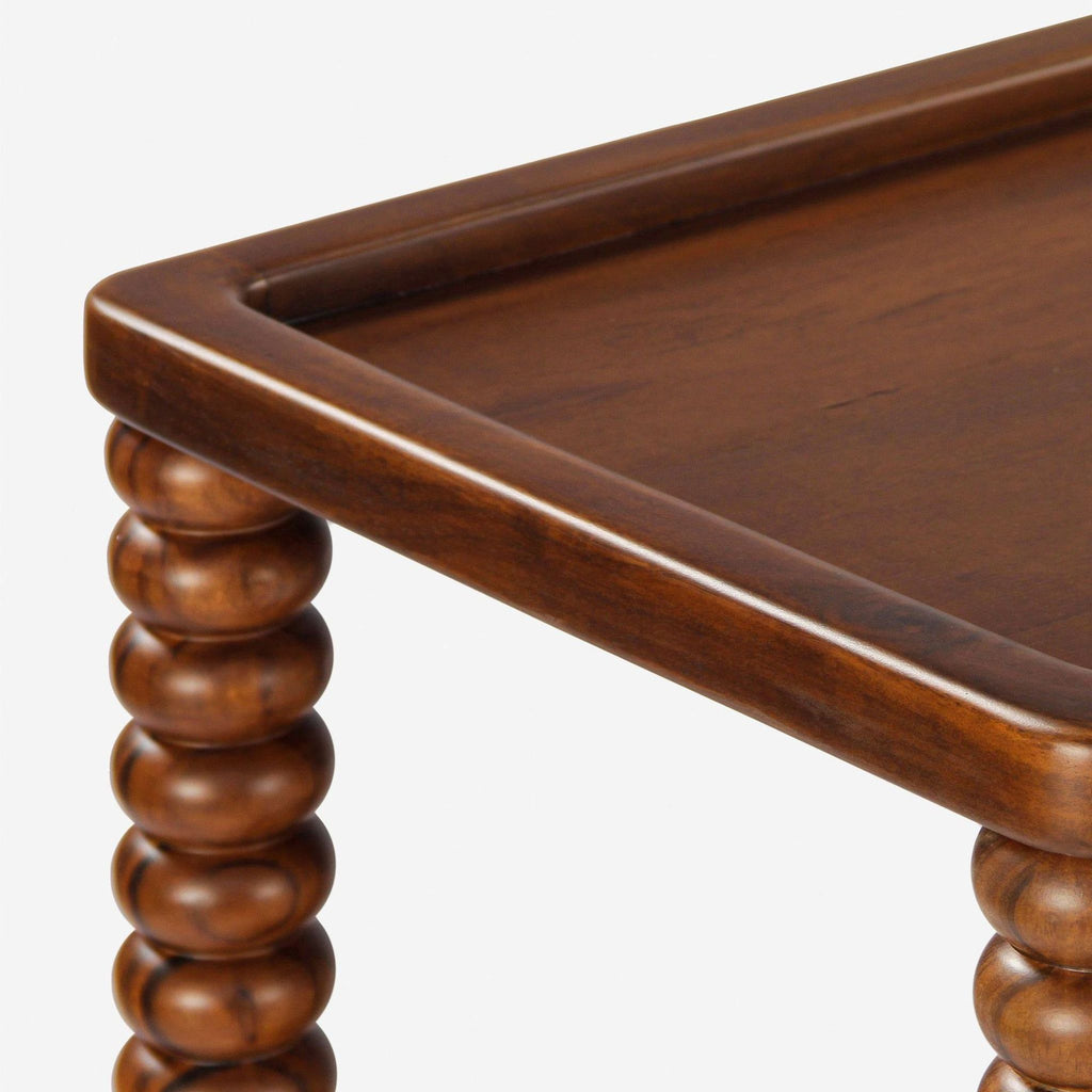 3. Close-up of the Lulu and Georgia side table’s rounded, turned wood legs and smooth tabletop corner.