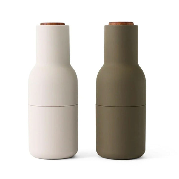 Set of two Audo Copenhagen grinders in light and dark, featuring a modern, minimalist design for spices.