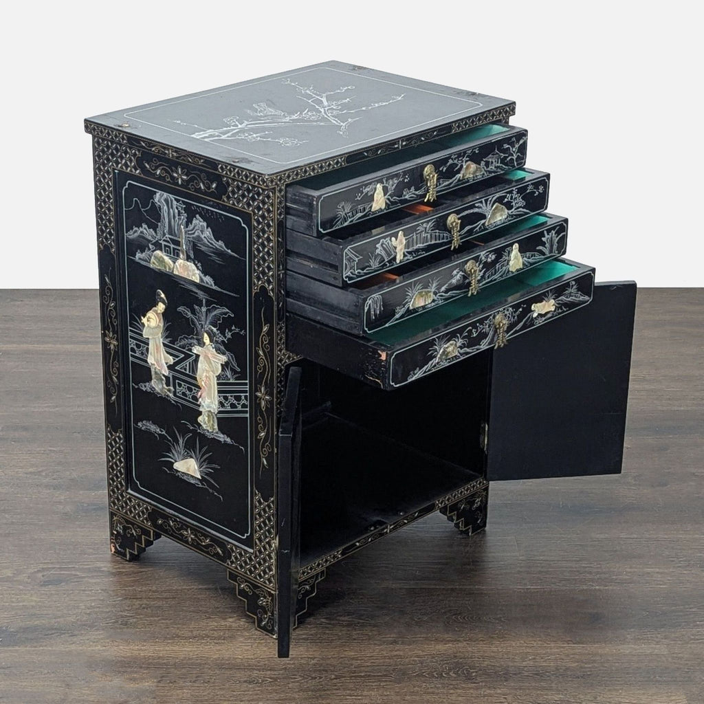 Elegant Chinese cabinet in black lacquer, featuring detailed mother-of-pearl designs on drawers and doors.