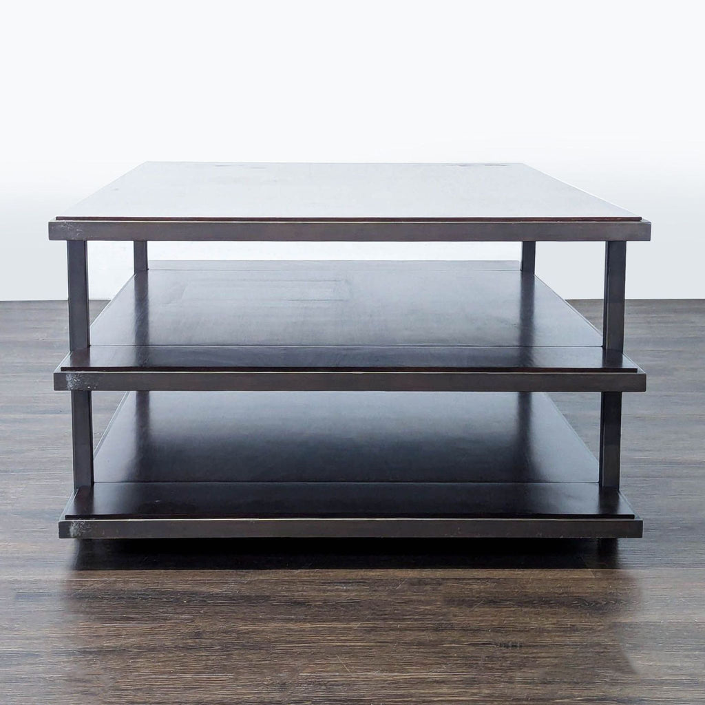 Wood and metal coffee table by Restoration Hardware, designed with open shelves.
