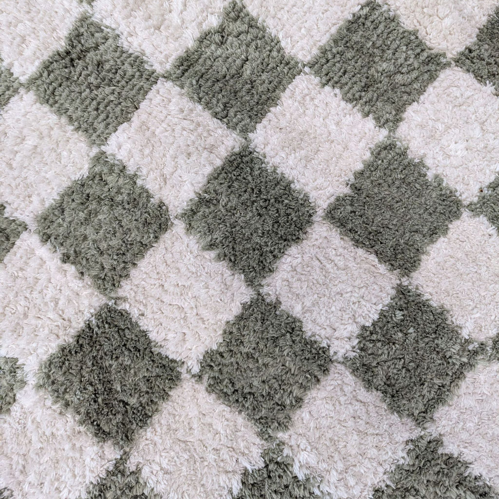 2. Close-up of the Livabliss rug’s soft and plush green and white checkerboard texture.