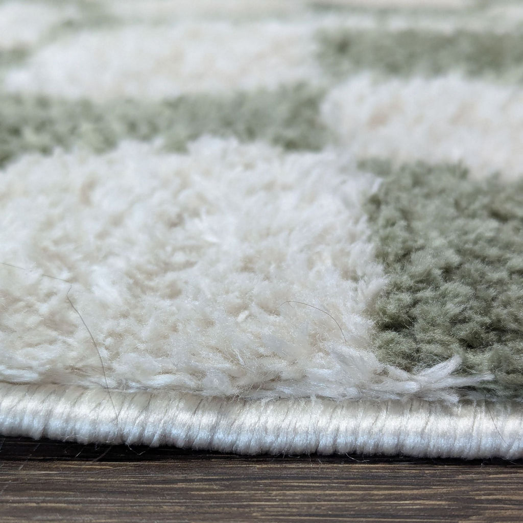 3. Side view showing the thickness and edge of the plush Livabliss checkerboard rug.