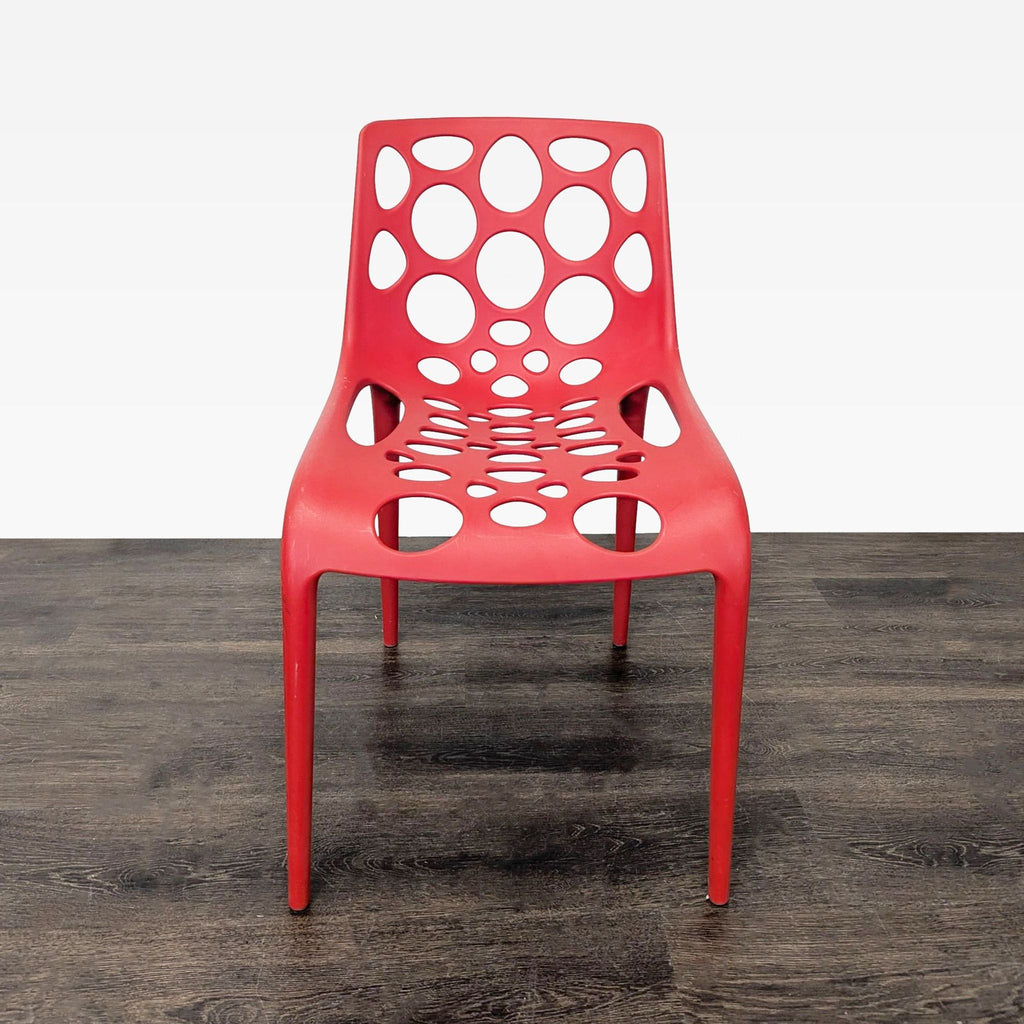 Red Plastic Dining Chair with Circle Cut-Outs