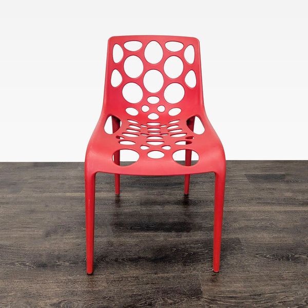 Red Plastic Dining Chair with Circle Cut-Outs