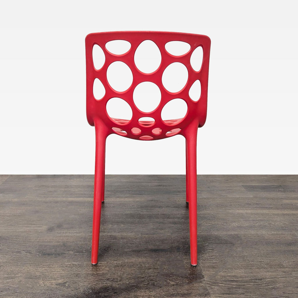 Red Plastic Dining Chair with Circle Cut-Outs