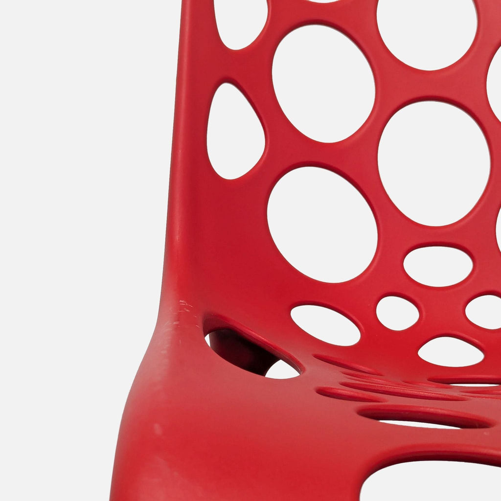 Red Plastic Dining Chair with Circle Cut-Outs