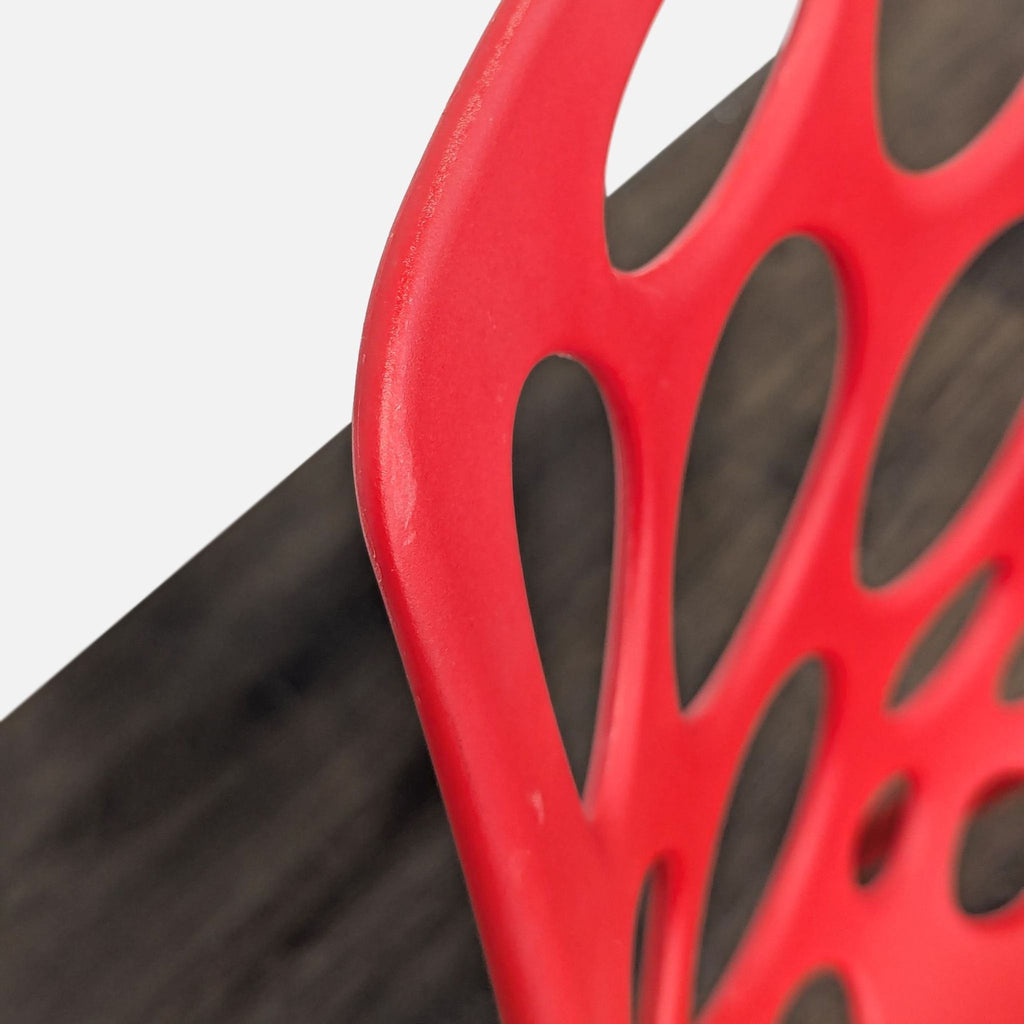 Red Plastic Dining Chair with Circle Cut-Outs