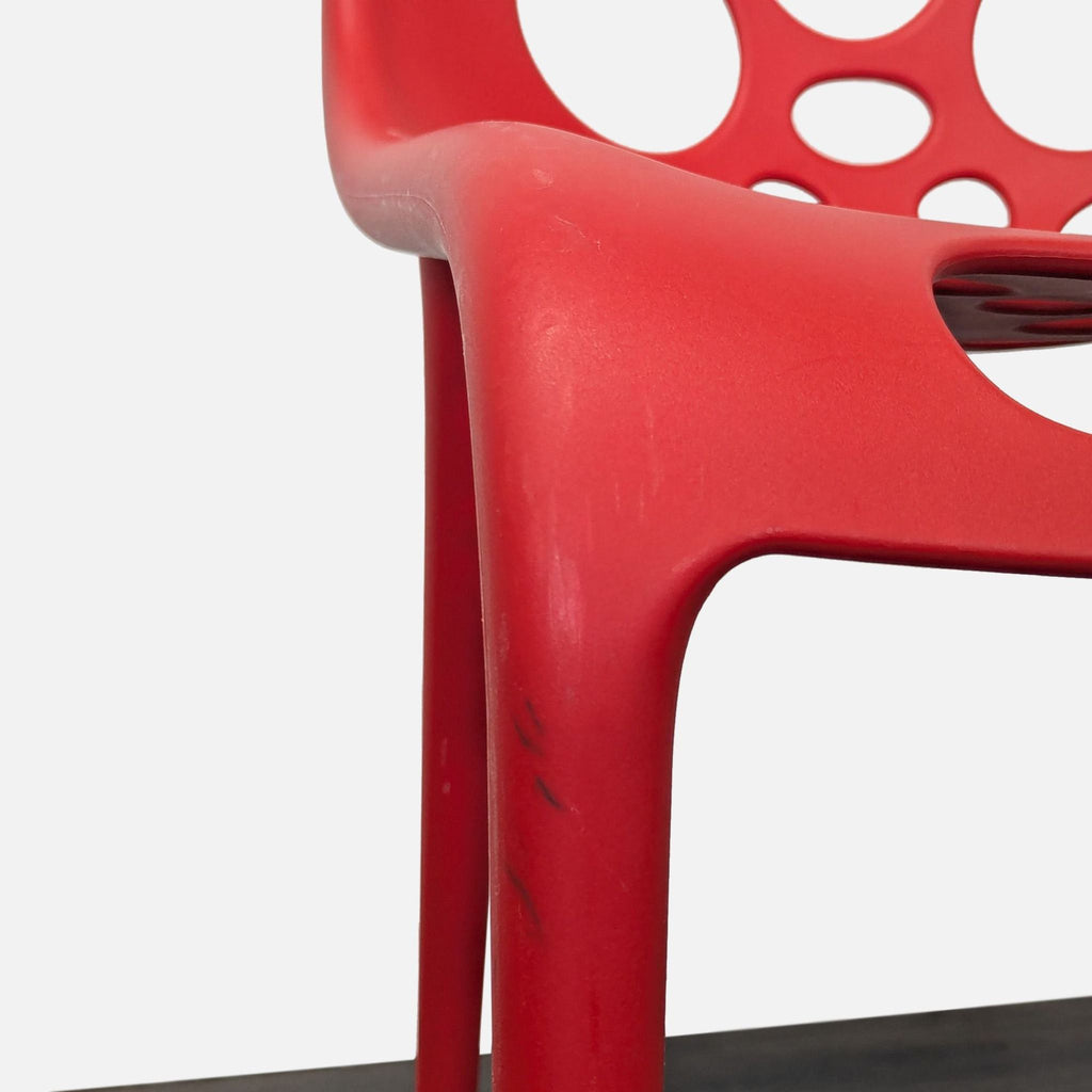 Red Plastic Dining Chair with Circle Cut-Outs