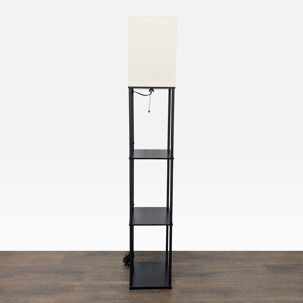 Modern black floor lamp for lighting, featuring a simple rectangular shade and built-in shelves for storage or decor.