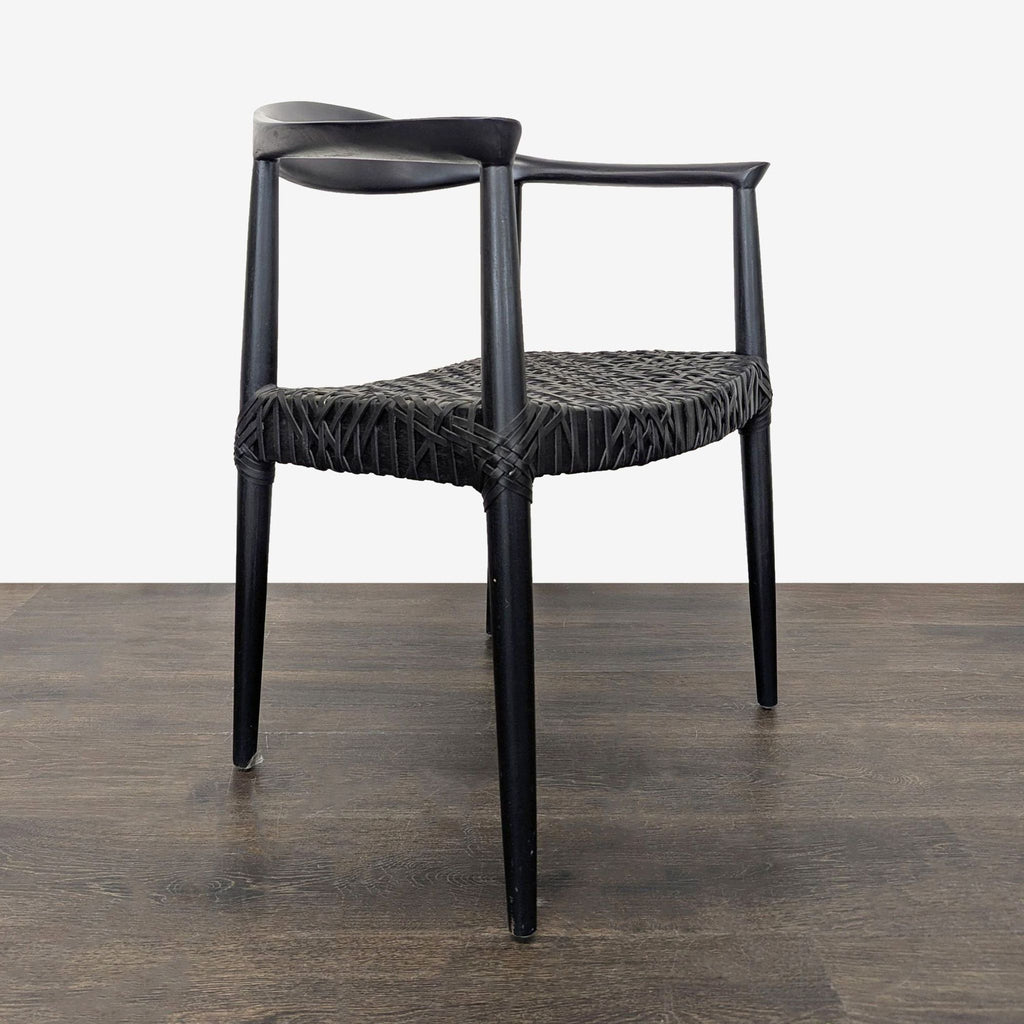 Contemporary dining chair featuring a reclaimed teak wood frame and black cowhide leather web seat.  