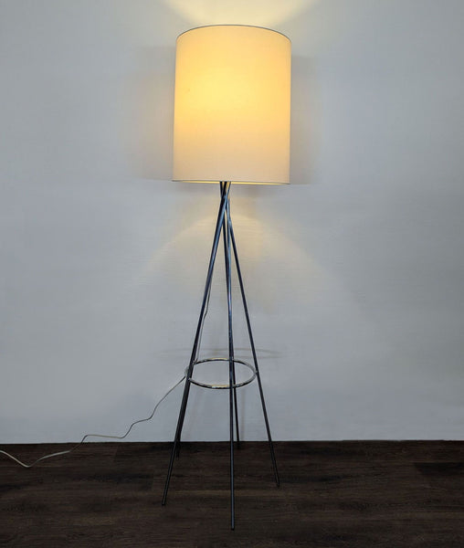 1. Modern floor lamp with a chrome tripod base and white cylinder shade, providing warm light for any room.  