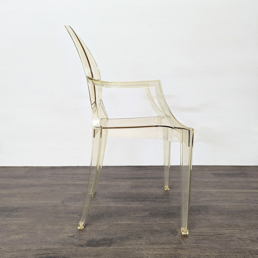 3. Profile view of a transparent dining chair with sleek legs, curved back, and minimalist design.