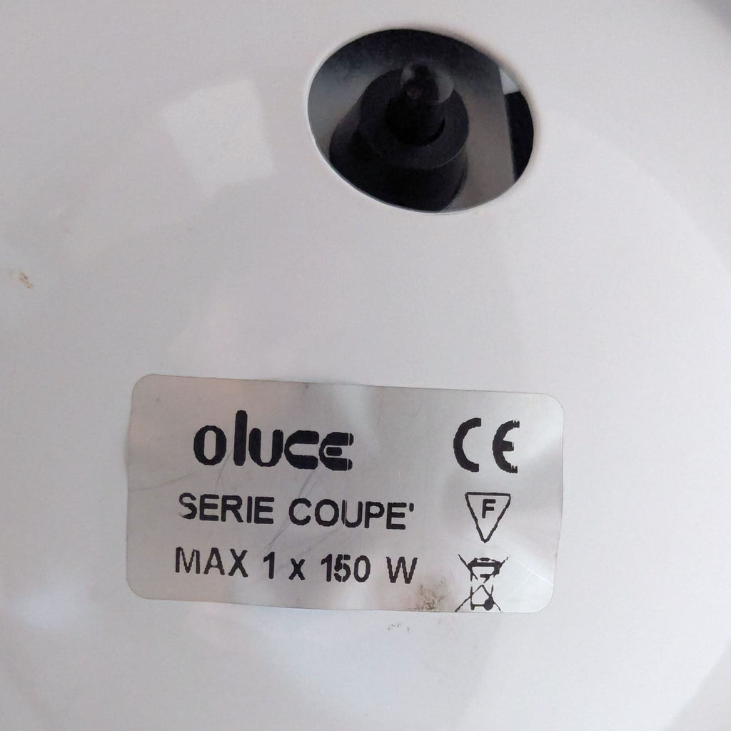 Sleek Oluce lighting: chrome arc, glossy black shade, sturdy base, adjustable arm; lamp not working.