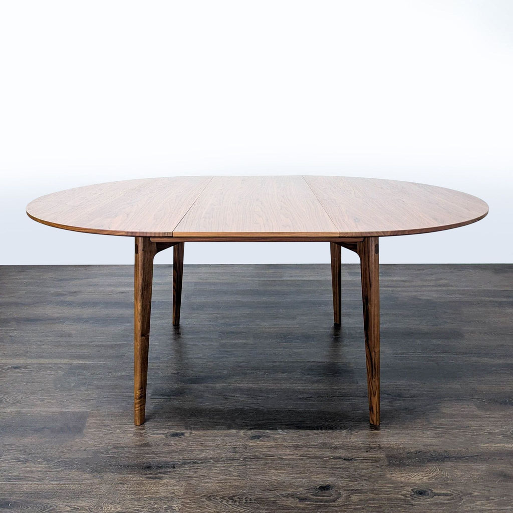 Dulwich Extension Table by Case: walnut dining table with visible through-tenons, solid edge banding, and space for six.