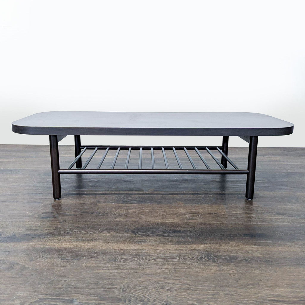 Ikea coffee table by Henrik Preutz in solid beech, featuring a ribbed lower shelf and protective lacquer finish.  