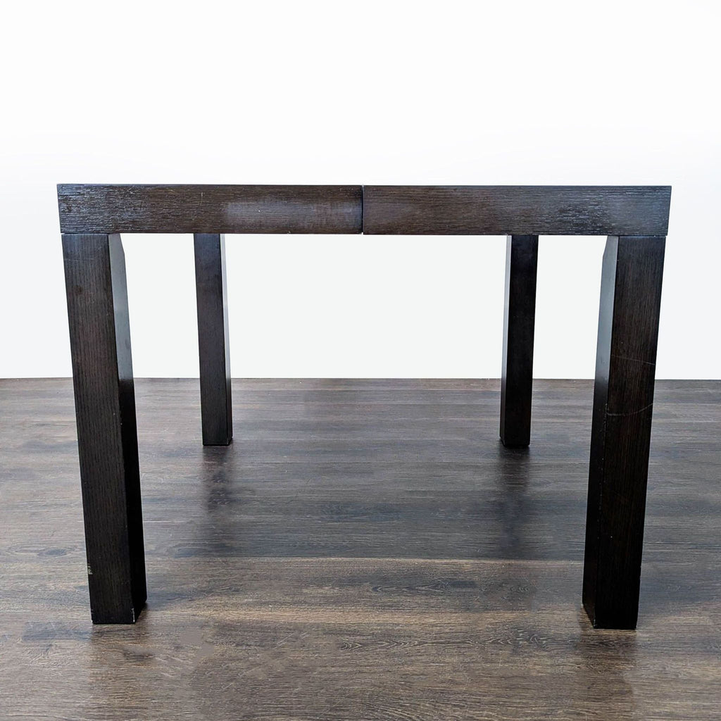 West Elm Parsons-style dining table with two extension leaves, modern and rectangular.